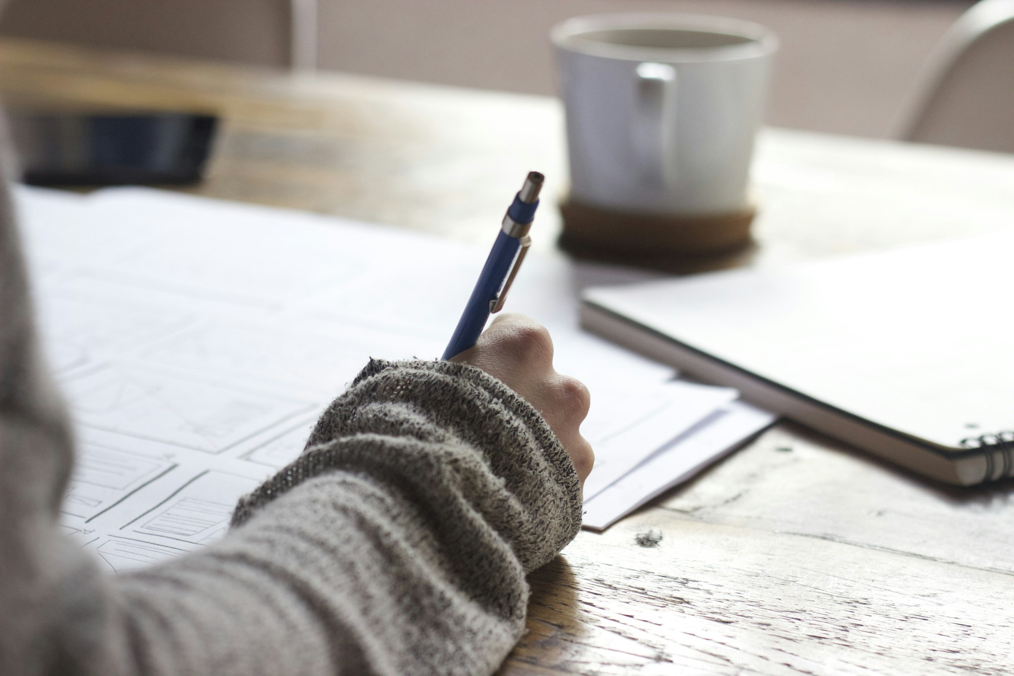 Student writing college application essay